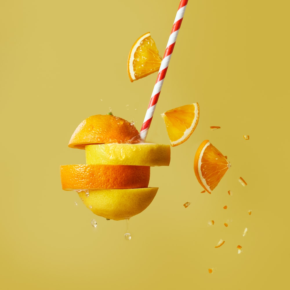 Sliced Orange Fruit With Straw raster image