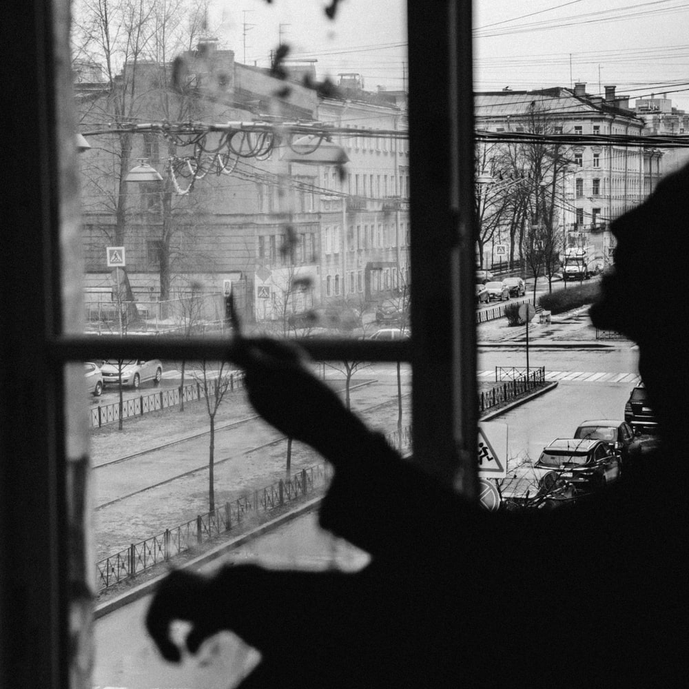 Silhouette Of Person Standing Near Window