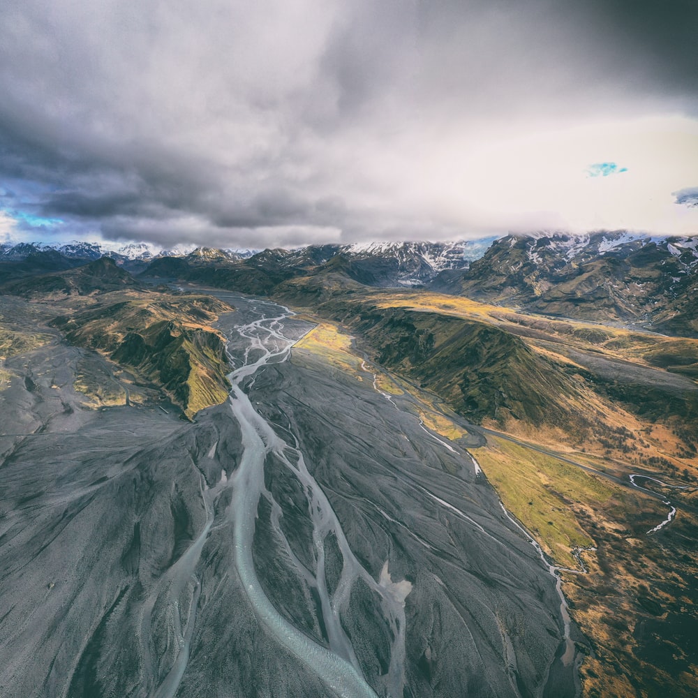 Gray And Green Mountain Under White Clouds During Daytime