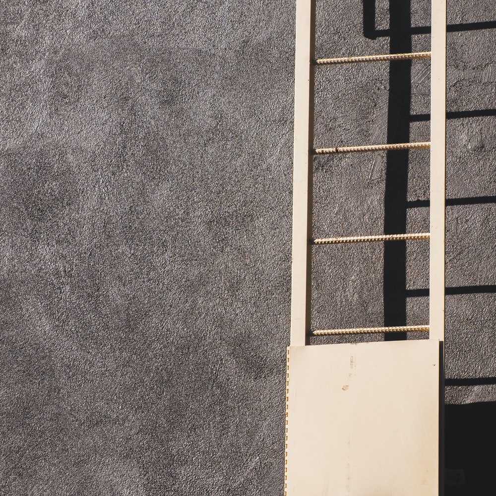 White Wooden Window Frame On Gray Concrete Wall raster image