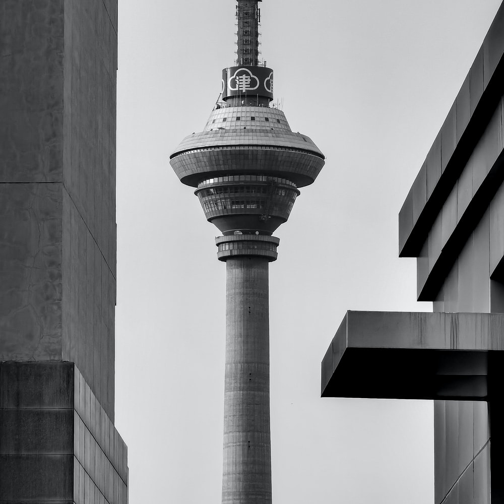 Gray Scale Photo Of Concrete Tower raster image
