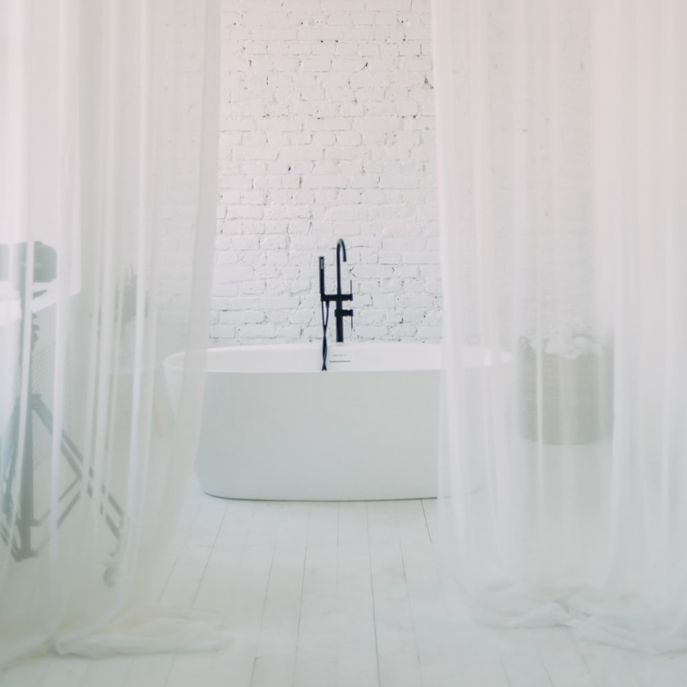 White Shower Curtain Near Bathtub