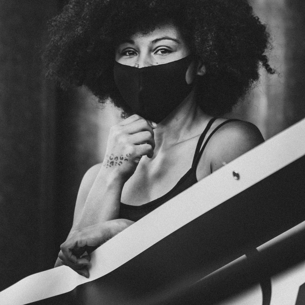 Grayscale Photo Of Woman Wearing Mask