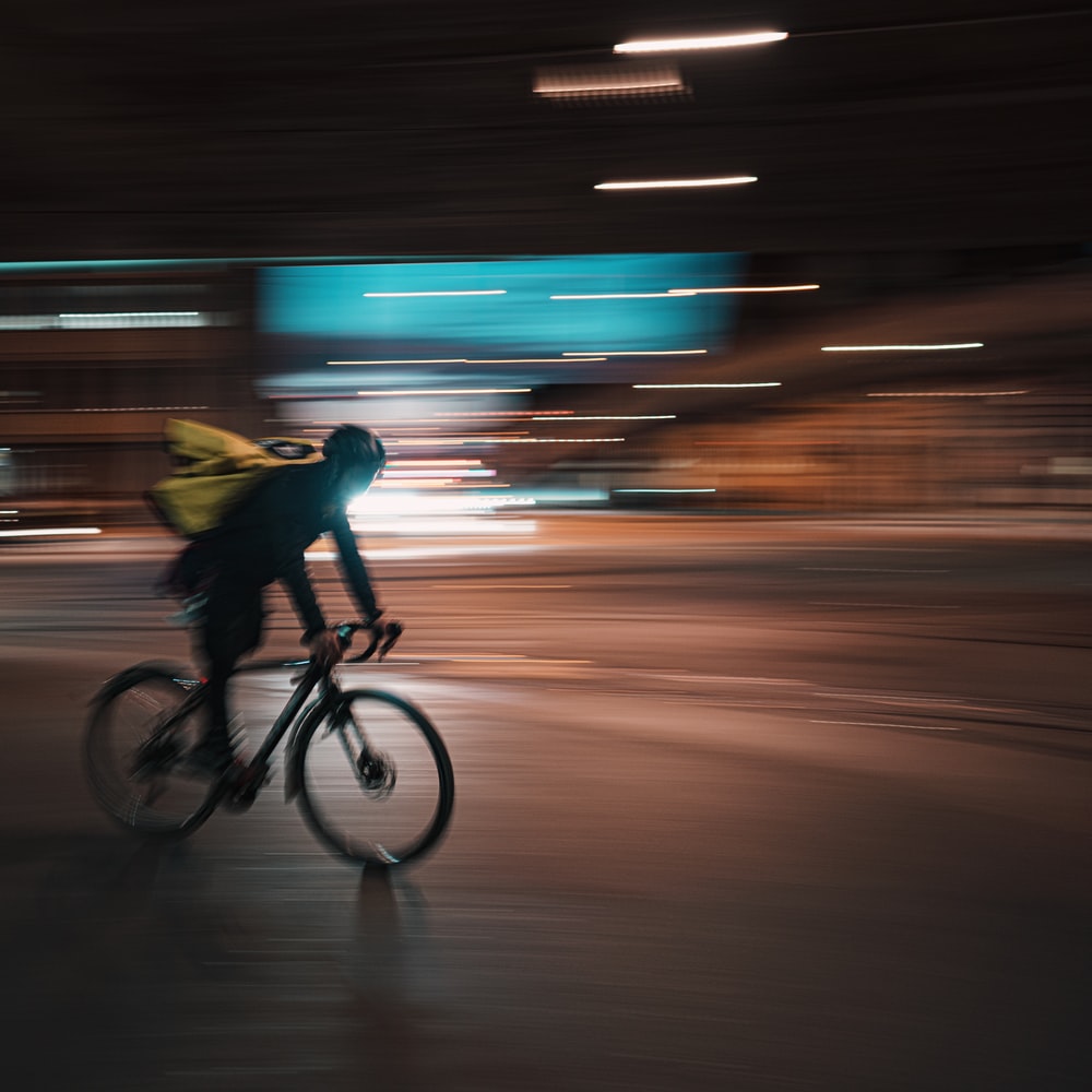 Man In Yellow Shirt Riding Bicycle raster image