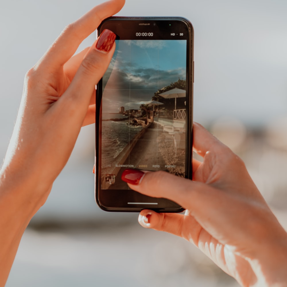 Person Holding Black Samsung Android Smartphone